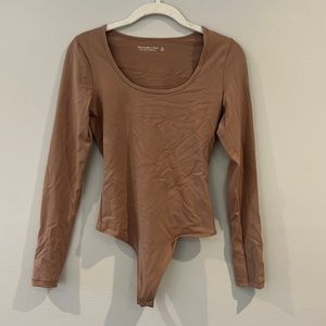 Never worn tan bodysuit